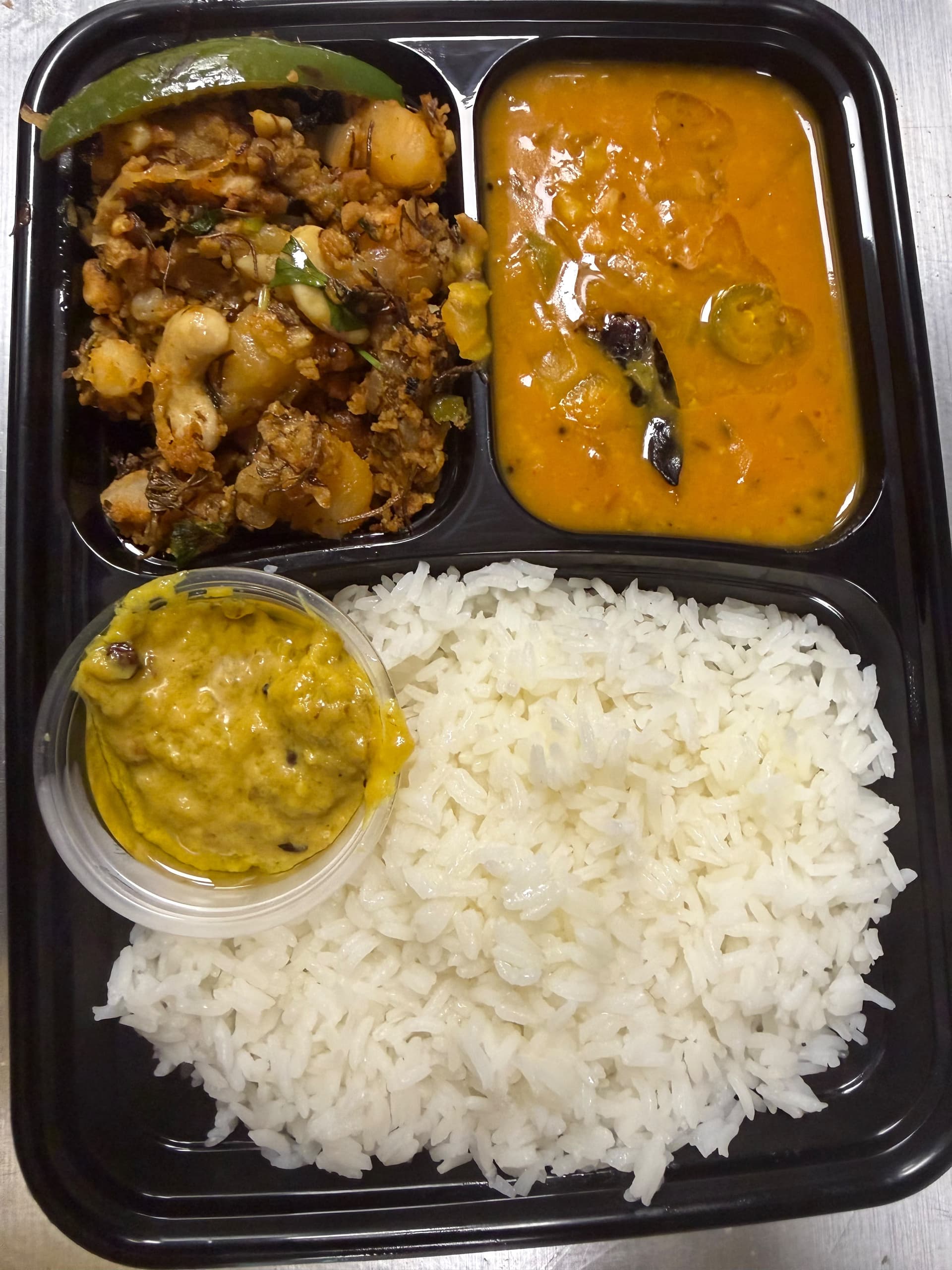 Desi Homestyle Lunch Combo including Veg Chintachiguru Keema Karam, Dosakaya Pappu, Roti Pachadi, Rice, and Desi Homemade Ghee for $9.99